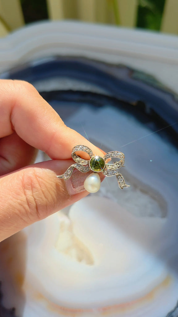 Platinum Antique Diamond Pave Ribbon Bow Brooch with Peridot | Indulgems