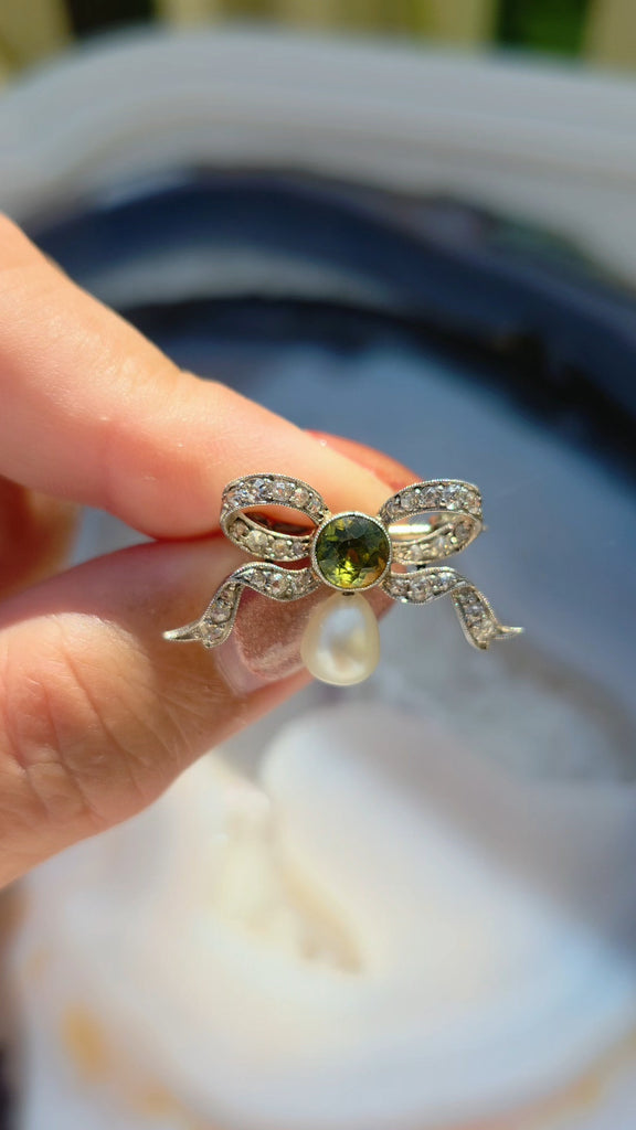 Platinum Antique Diamond Pave Ribbon Bow Brooch with Peridot | Indulgems