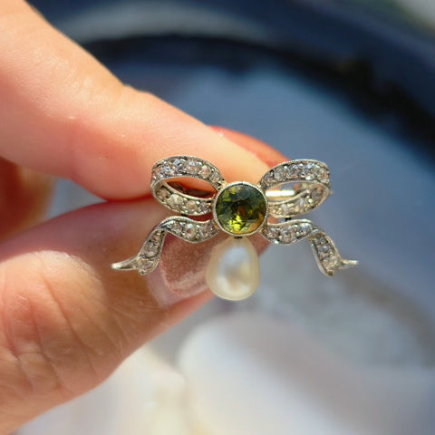 Platinum Antique Diamond Pave Ribbon Bow Brooch with Peridot | Indulgems