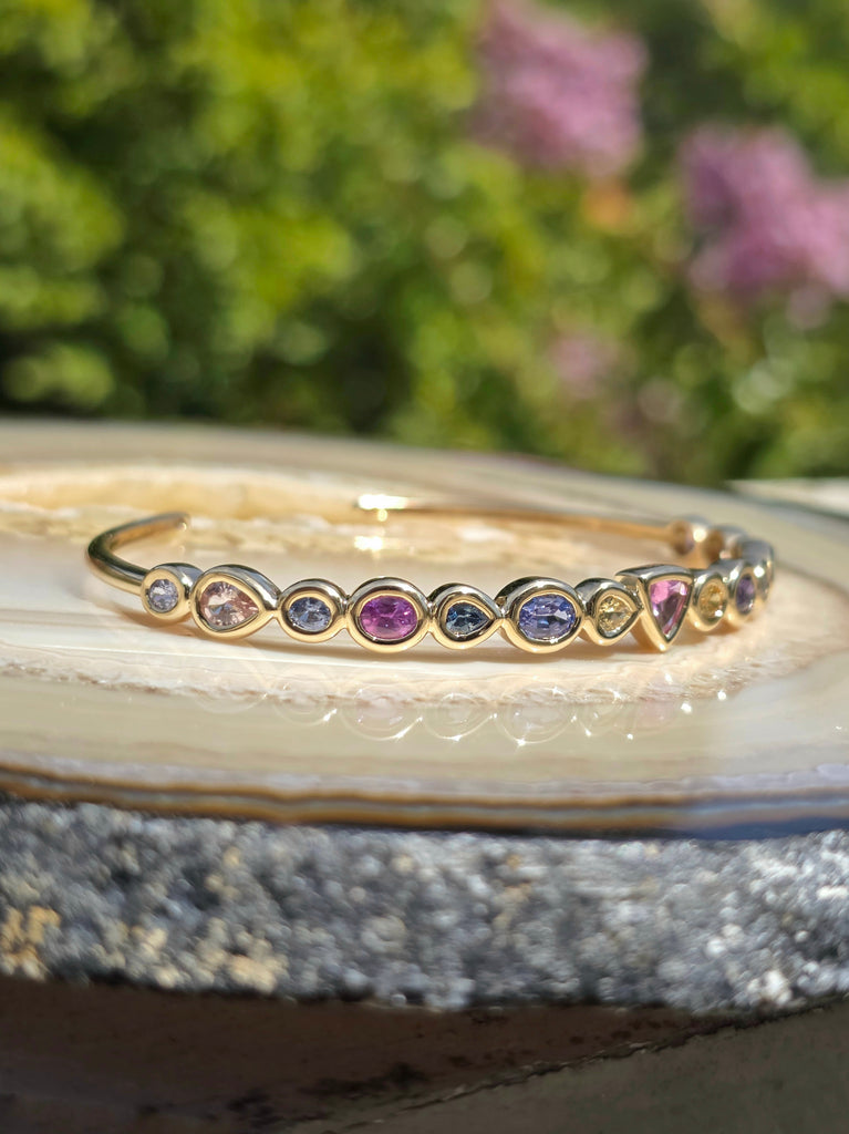 14k Yellow Gold Chubby Donut Bezel Fancy Sapphire Cuff Bangle | Indulgems