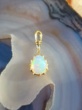 14k Yellow Gold Aurora Pendant with Ethiopian Opal Cabochon | Indulgems
