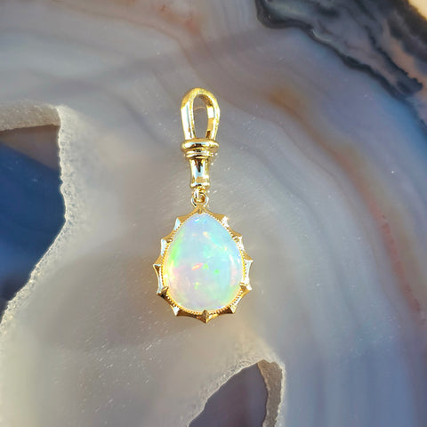 14k Yellow Gold Aurora Pendant with Ethiopian Opal Cabochon | Indulgems